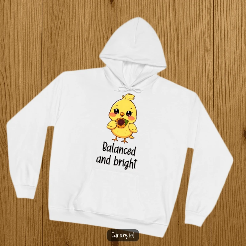 Funny canary bird hoodie, radiant smile, balancing a sunflower seed on its nose, comfortable and cheerful apparel.