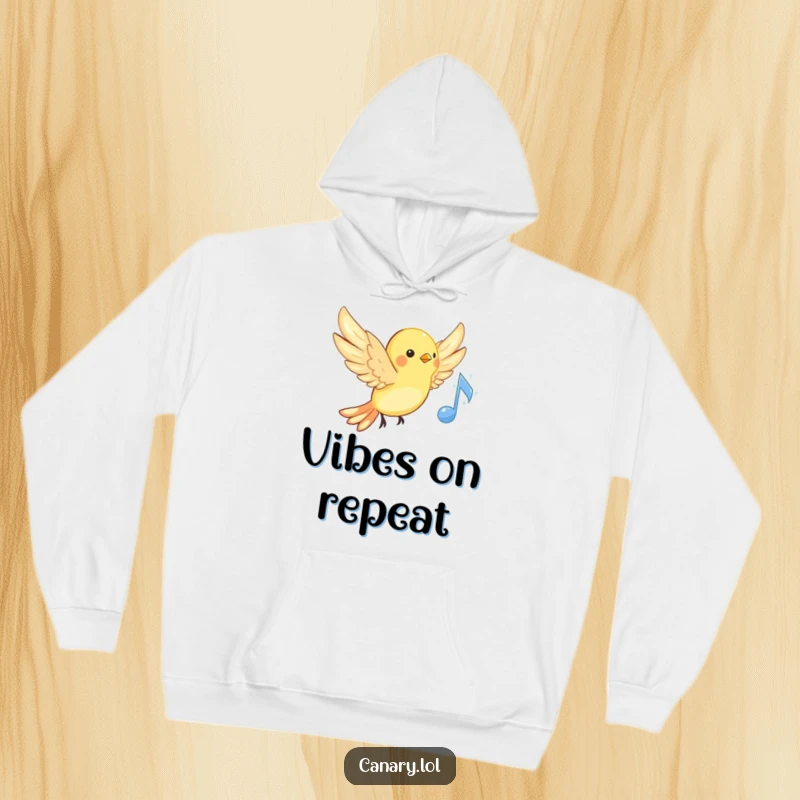 Funny musical canary hoodie, wings spread, hovering near a sparkling musical note, cozy and warm apparel, perfect gift.